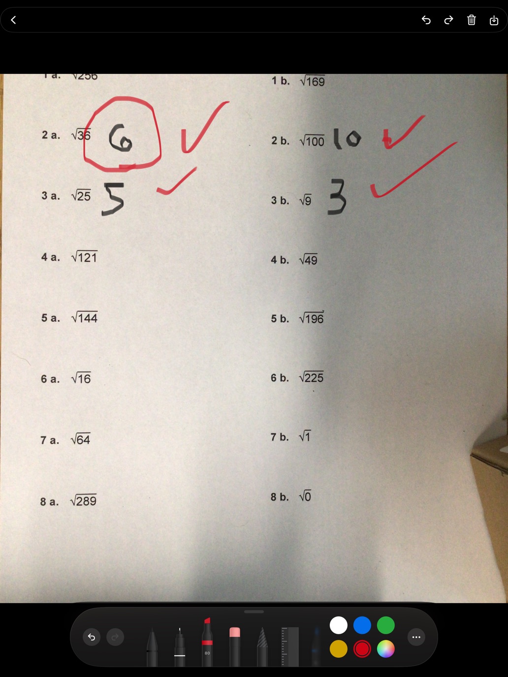 A captured worksheet with answers circled and ticked in red pen, the pencil palette open at the bottom.